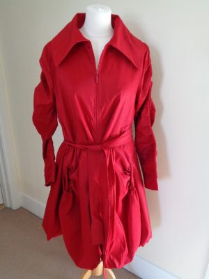 RARITY RED BELTED COAT WITH PUFF BALL HEM DETAIL