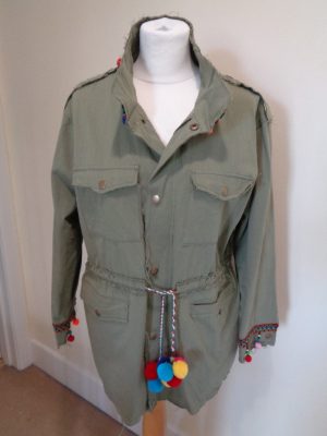 FOREVER UNIQUE KHAKI SAFARI JACKET WITH FEATURE BACK DETAIL AND POM POMS